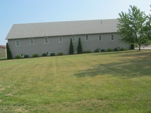 KIngsville Old Colony Mennonite Church with grass in front
