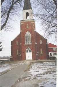 Red brick church with a tall steeple
