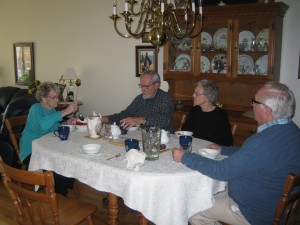 Visiting around the table with new friends goes well with strawberries and ice cream!