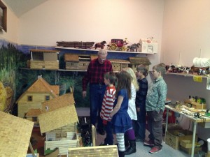 Jake Lehn, giving a tour of his miniature buildings, located on the second floor of the museum