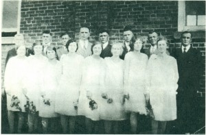 Baptismal group in 1929. Front row: Sara ersau, Agatha P. Tiessen, Tina Schmidt, Manja Driiedger, Tina Esau, Marry G. Tiessen, Helene Huebert, and Lena Koop[. Second Row: Rerv. J. H. Janzen, Abtam Wilms, Diedrich Esau, David Tjart, Jacob Martens, Woldemar Unger, Ministers: C. H.Tiessen and Jac. D. Janzen