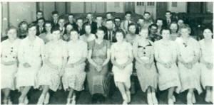  Junior choir in 1936 or 37. Front row, left to right: Helen Schellenberg,  Henriette Warkentin, Melita Baerg, Johanna Schroeder, Olga Toews, Gertrude  Enns, Anna Bergen, Agatha Driedger, Gertrude Hamm, Agnes Wiens.  Second row: Sally Cornies, Kathe Dick, Erna Mathies, Mary Unrau, Henry  Krueger (Director), Elizabeth Toews, Helen Cornies, Mary Neuman. Third  row: Martin Tiessen, Peter Wiens, Henry Epp, Peter Tiessen, Jake Cornies,  Henry Warkentin, Annie Dick, unknown. Fourth row: Ernie Neuman, John  Willms, John Tiessen, Nick N. Tiessen, John P. Driedger, Jake Toews, Dick  Walde, Jake Tiessen.  