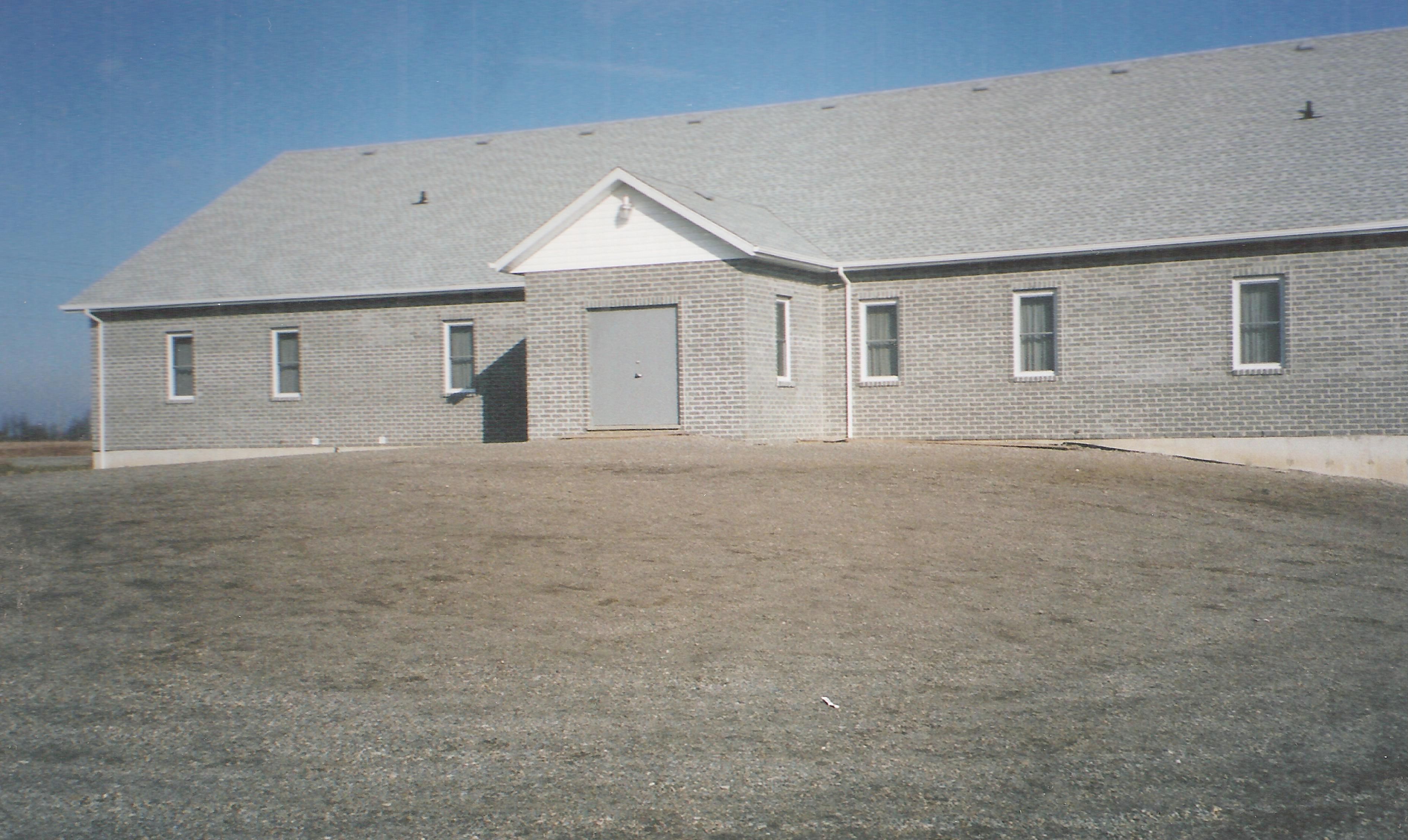 Long gray brick church