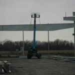 Putting on the beams for the roof of Uni-Fab