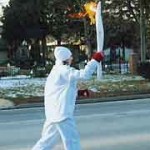 Taylor Balkwill running with torch