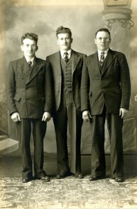 Abram Epp, centre, with brothers Peter and Henry Johnson. 1947, Leamington, Ontario
