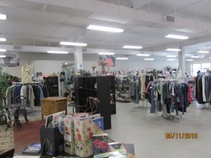 Donated items for sale on racks and shelves
